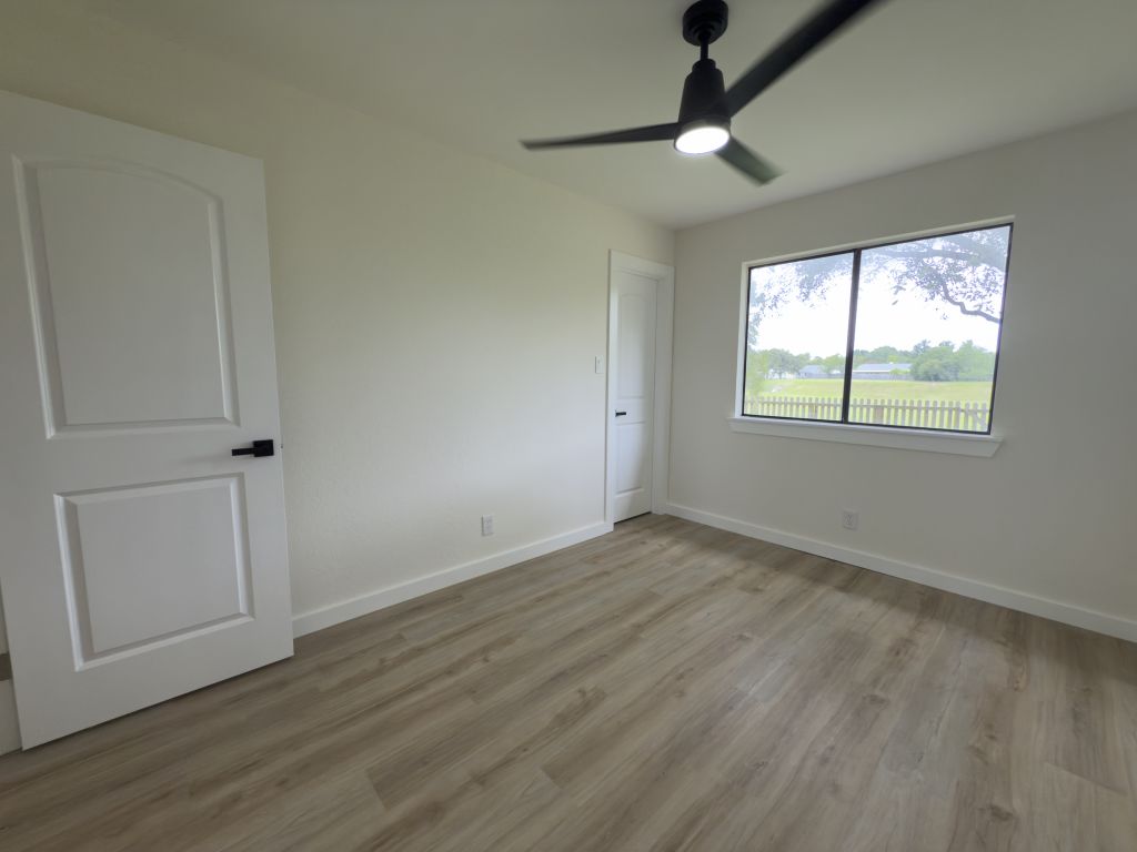 818 Russet Valley Drive Cedar Park, TX 78613 - Photo 10 of 17 Unfurnished bedroom featuring light wood finished floors and ceiling fan