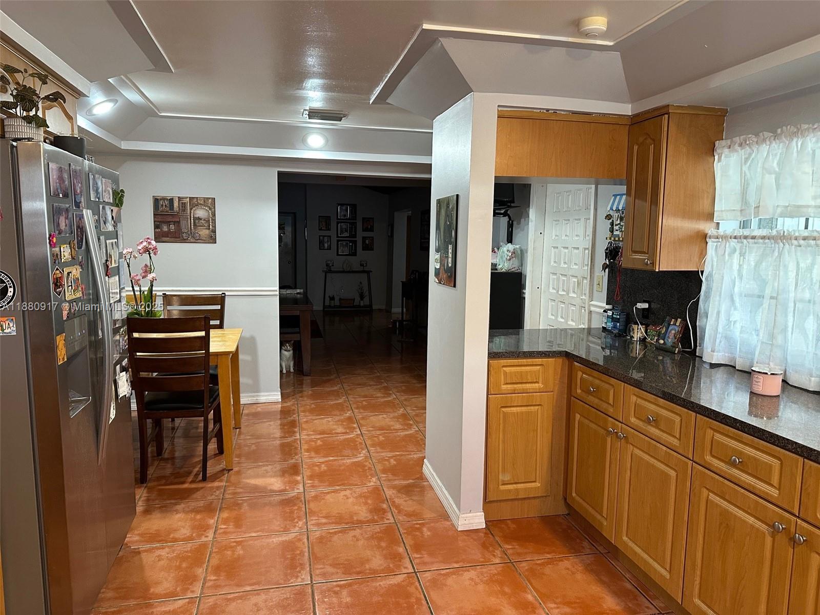 12495 Southwest 240th Street Homestead, FL 33032 - Photo 11 of 26 a kitchen with stainless steel appliances granite countertop a refrigerator and a stove top oven