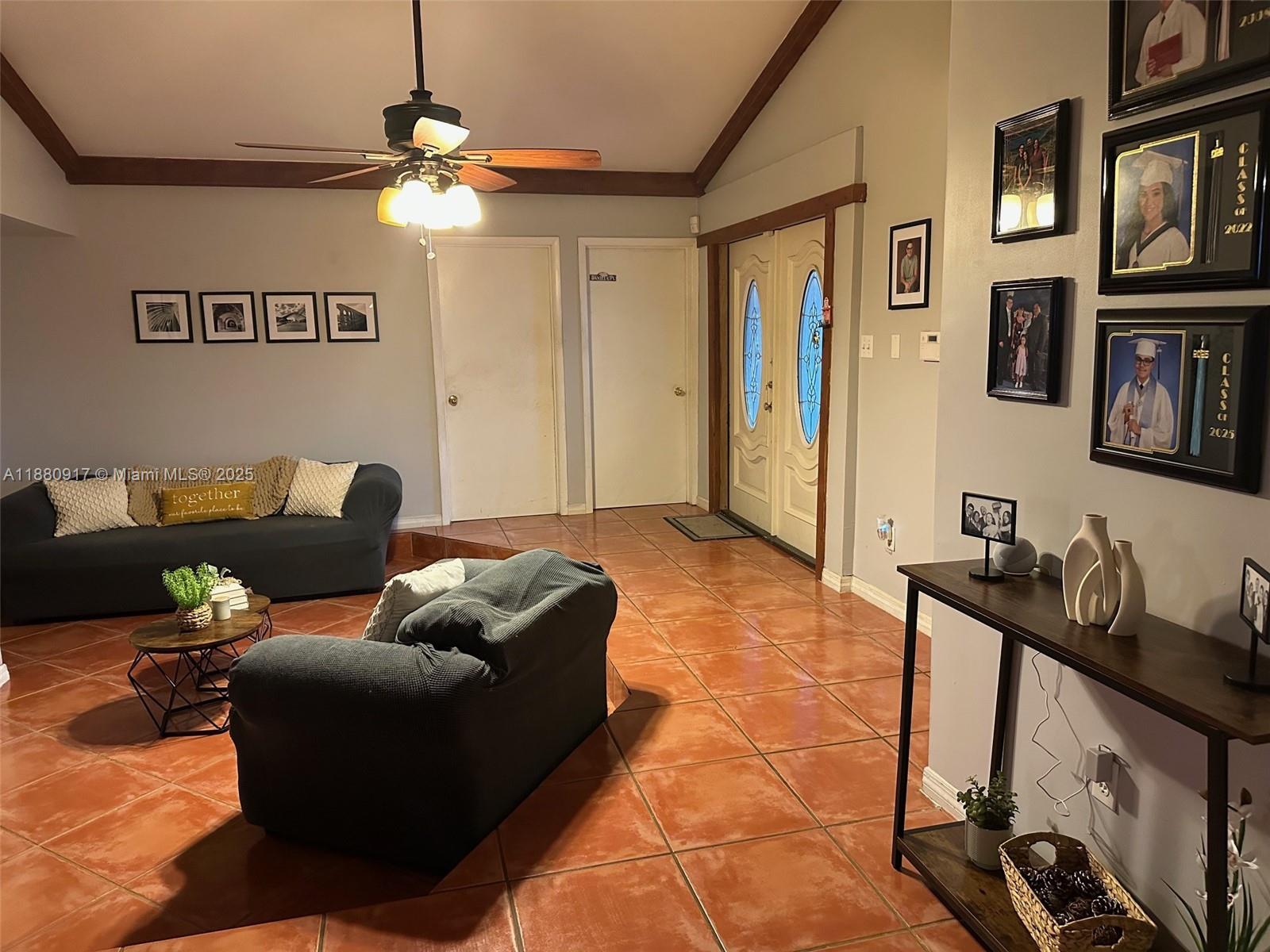 12495 Southwest 240th Street Homestead, FL 33032 - Photo 4 of 26 a living room with furniture and a flat screen tv