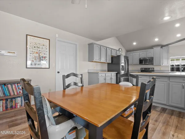 a kitchen that has a lot of cabinets a sink and dishwasher in it