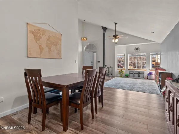 a view of a dining room with furniture and wooden floor