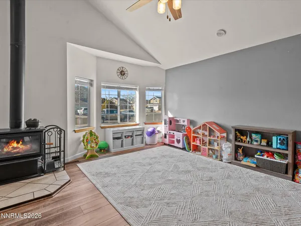 a view of entryway livingroom and hall with wooden floor