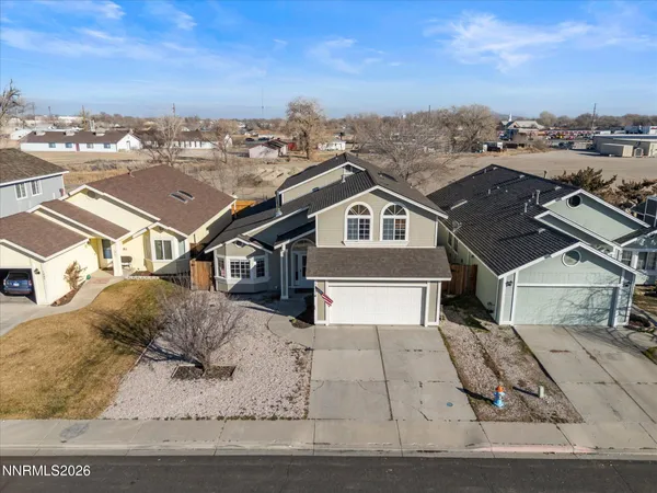 an aerial view of residential houses with outdoor space
