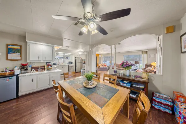a view of a dining room with furniture and wooden floor
