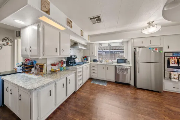 a view of a livingroom with furniture and a window