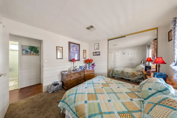 a bathroom with a sink mirror and a bathtub