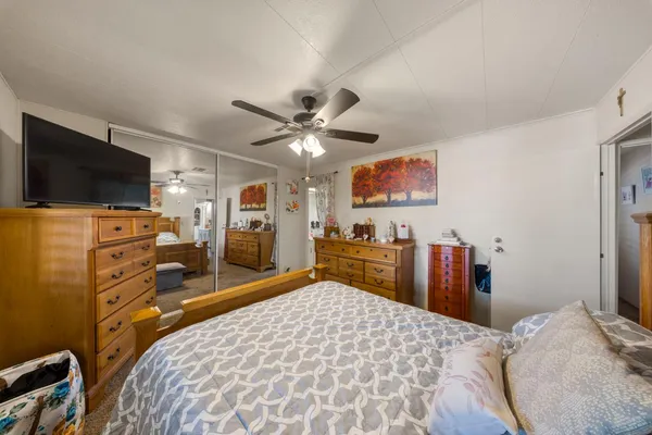 a view of a patio with table and chairs and potted plants