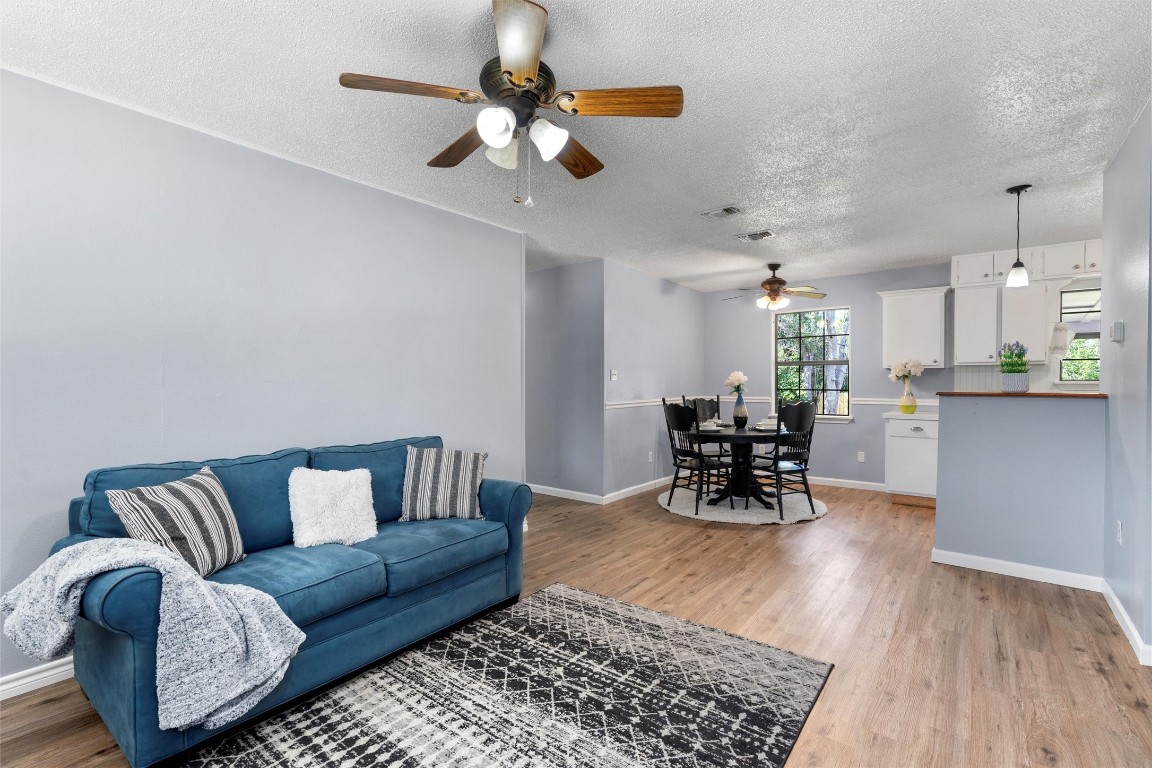 701 Mockingbird Lane Taylor, TX 76574 - Photo 1 of 1 a living room with furniture and kitchen view