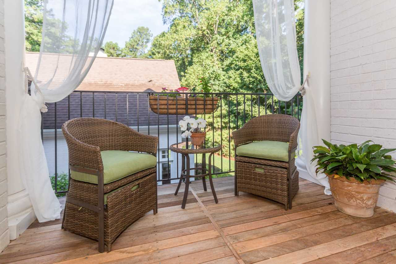4921 Cremshaw Court Raleigh, NC 27614 - Photo 14 of 25 The master balcony overlooks the courtyard and offers a quaint setting for drinking a cup of coffee, sipping a glass of wine, or reading a good book. Romantic Master Balcony