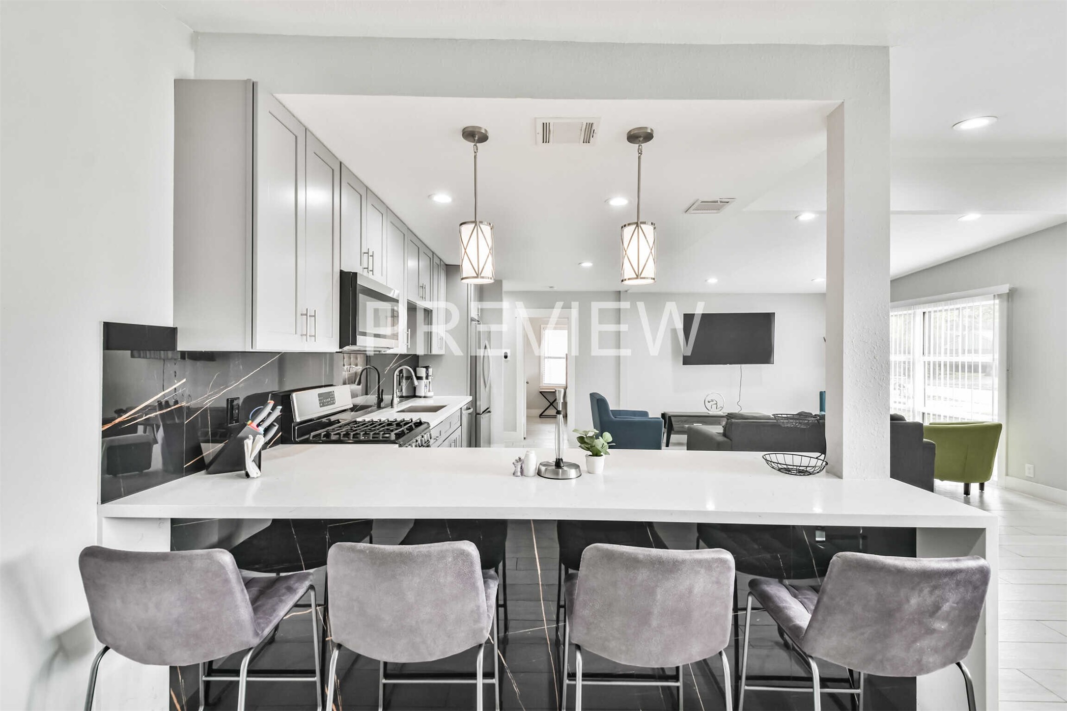 7522 Dearborn Street Houston, TX 77055 - Photo 19 of 39 a kitchen with a dining table chairs and large window
