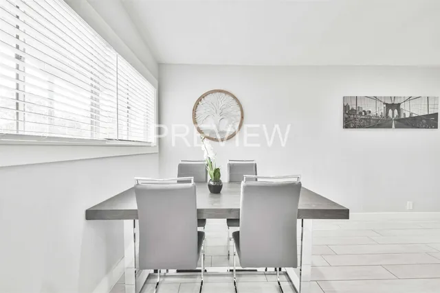 a view of a room with furniture and window