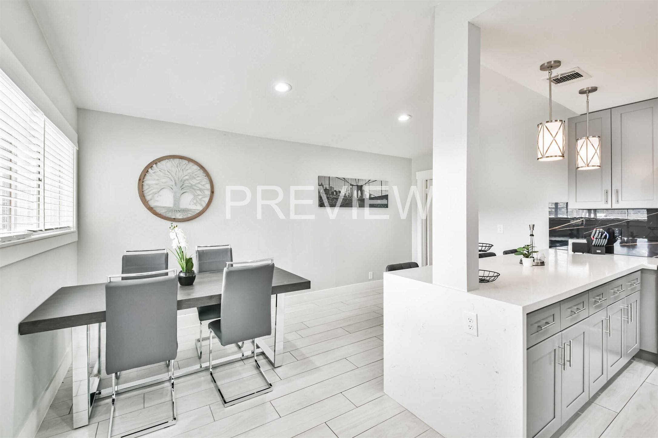 7522 Dearborn Street Houston, TX 77055 - Photo 25 of 39 a kitchen with a dining table and chairs