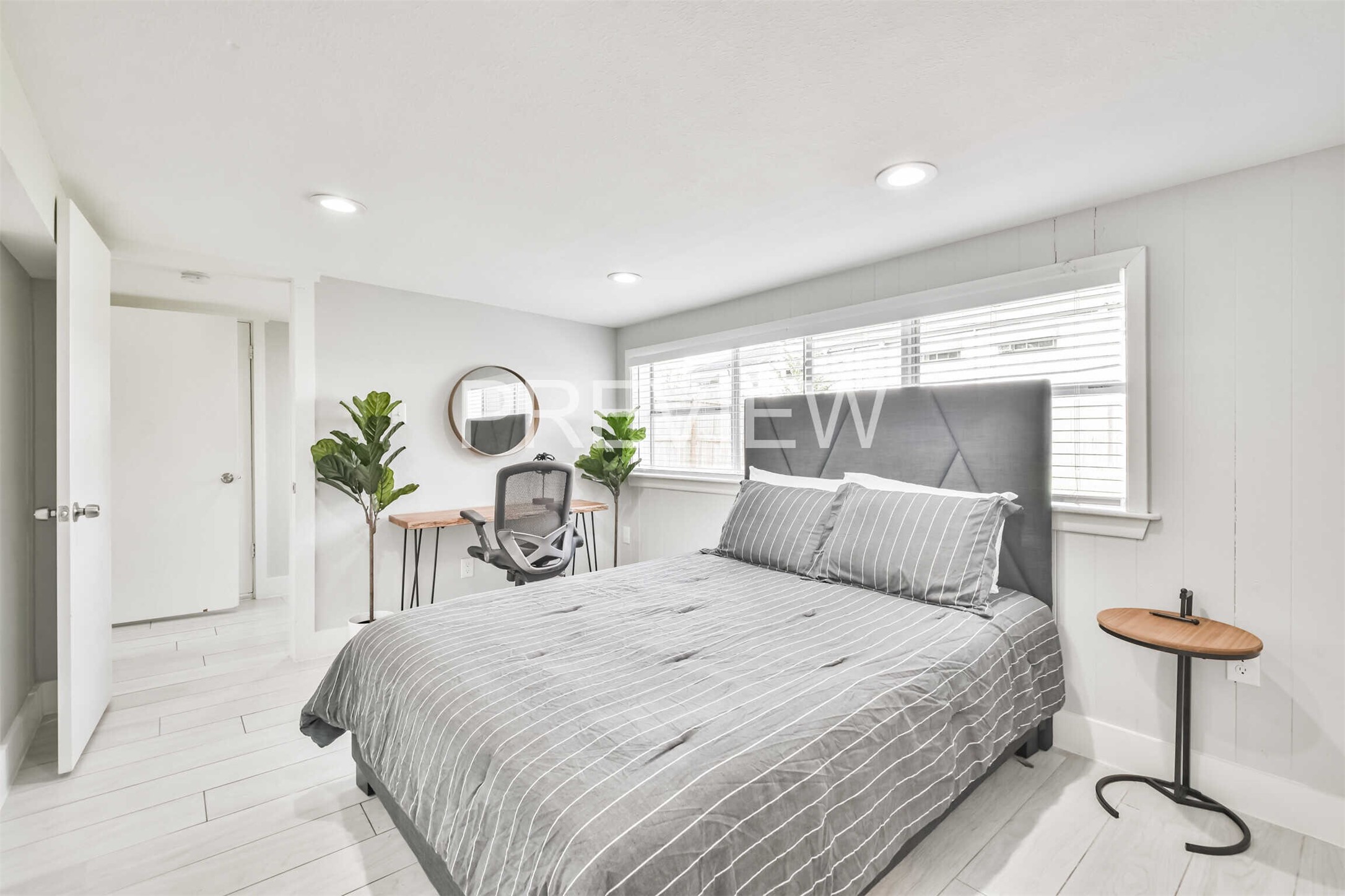 7522 Dearborn Street Houston, TX 77055 - Photo 28 of 39 a bedroom with a bed and chandelier