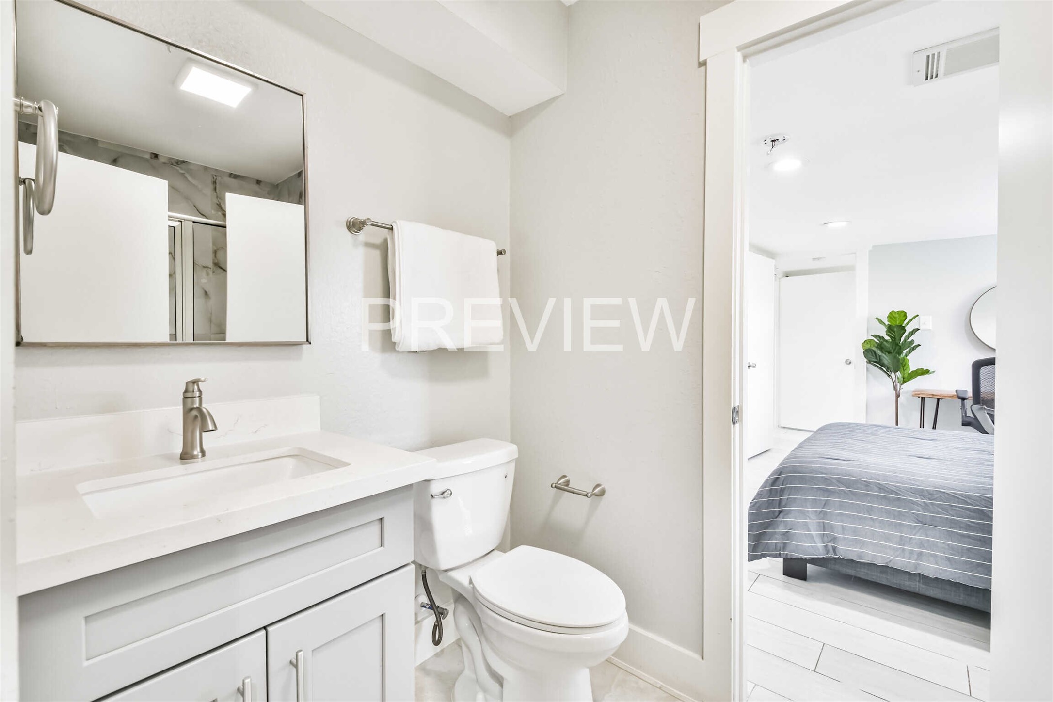 7522 Dearborn Street Houston, TX 77055 - Photo 29 of 39 a bathroom with a sink a toilet and a mirror