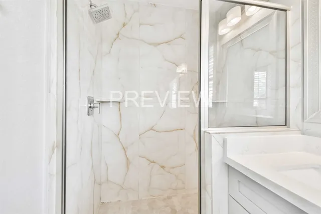 a bathroom with a bathtub and shower