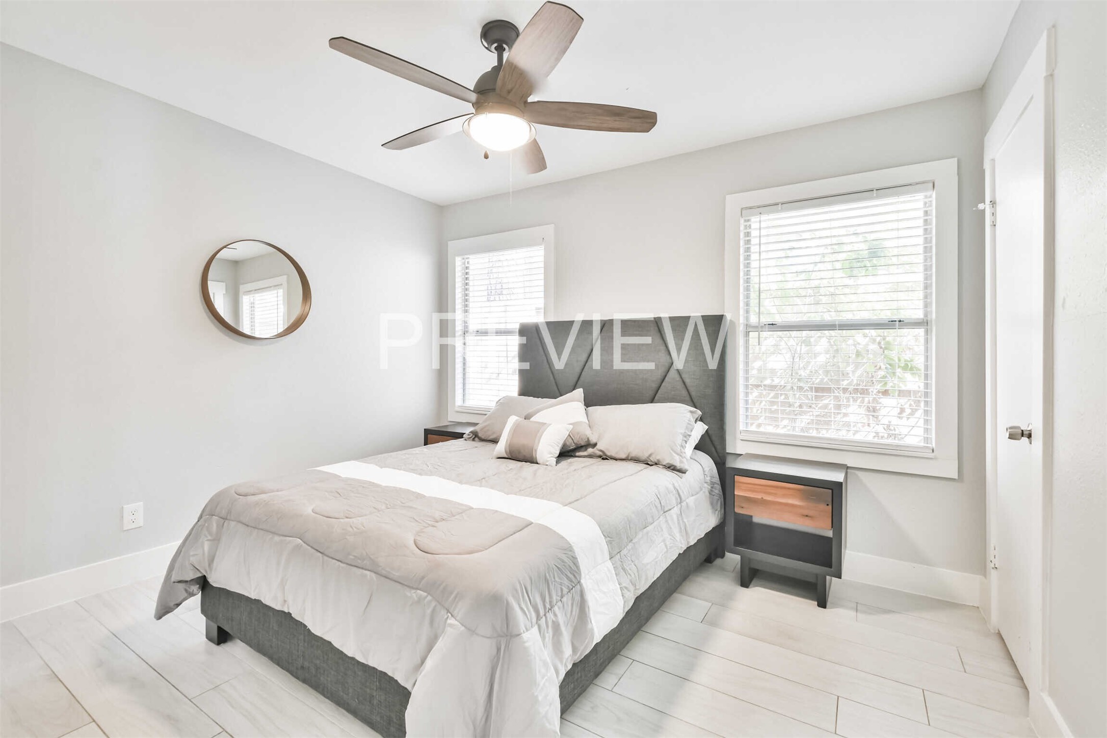 7522 Dearborn Street Houston, TX 77055 - Photo 36 of 39 a bedroom with a large bed and a chandelier