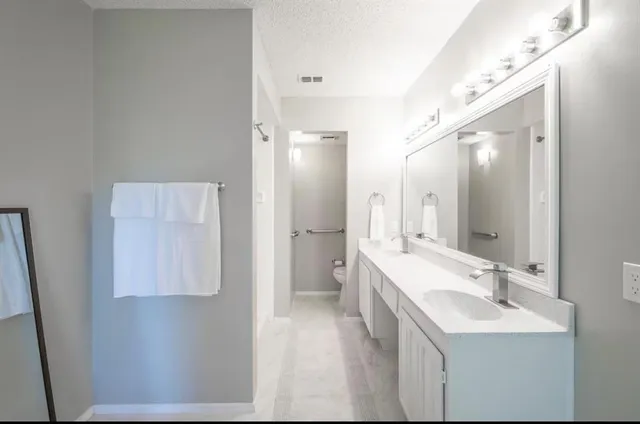 a bathroom with a sink and mirror
