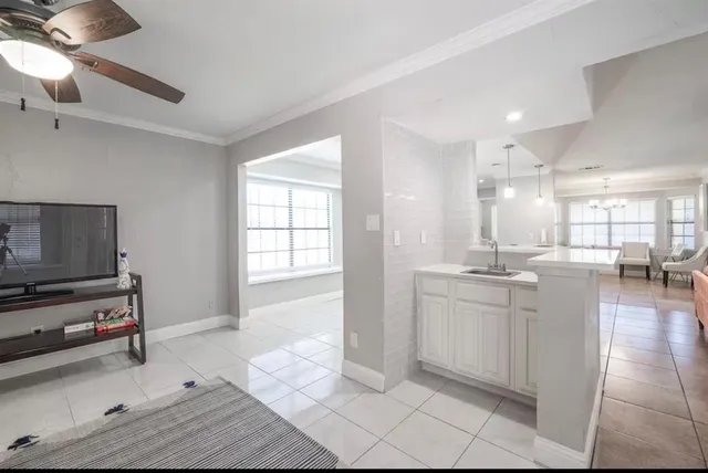 a kitchen with sink and cabinets