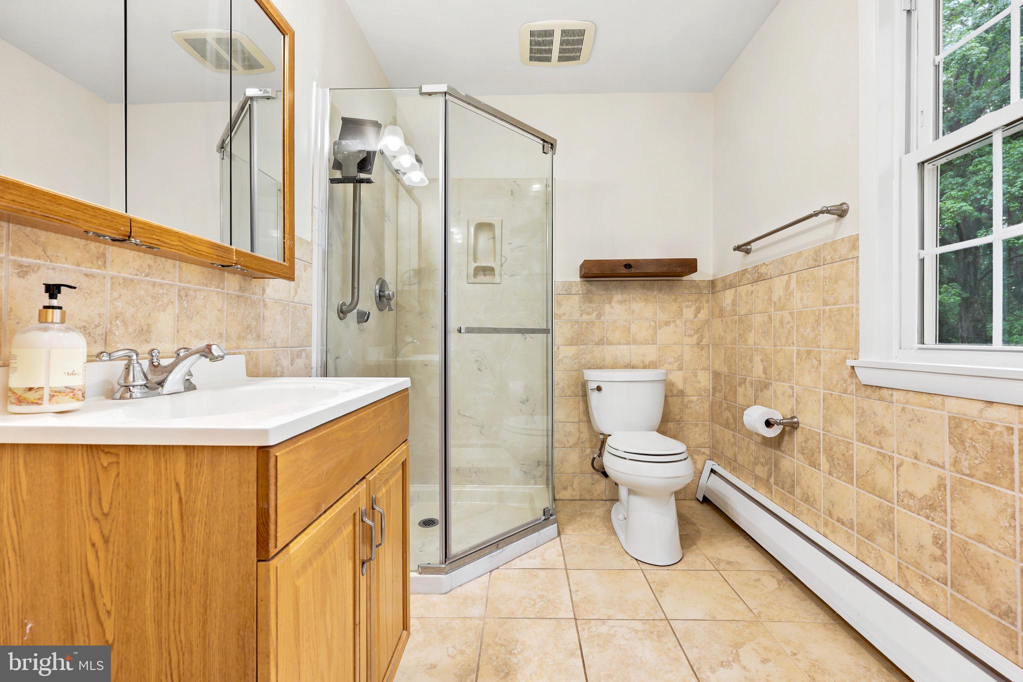 412 Yorkshire Road Bryn Mawr, PA 19010 - Photo 18 of 25 a bathroom with a granite countertop sink toilet and shower