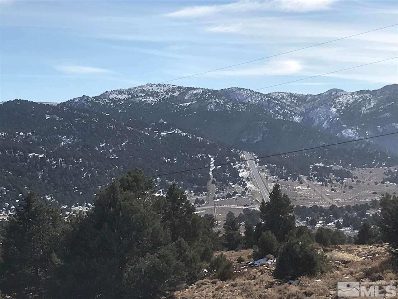 a view of a city of mountains and city view