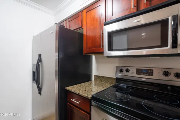 a kitchen with a stove and a microwave