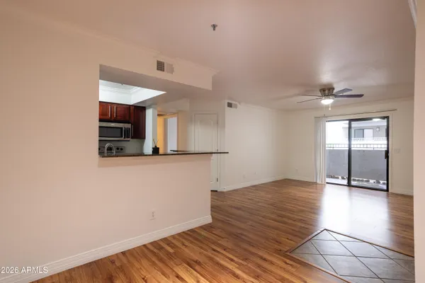 a view of a livingroom with wooden floor