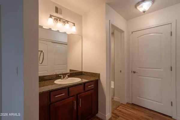 a bathroom with a sink and a mirror