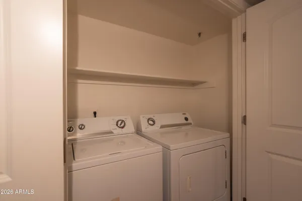a utility room with dryer and washer