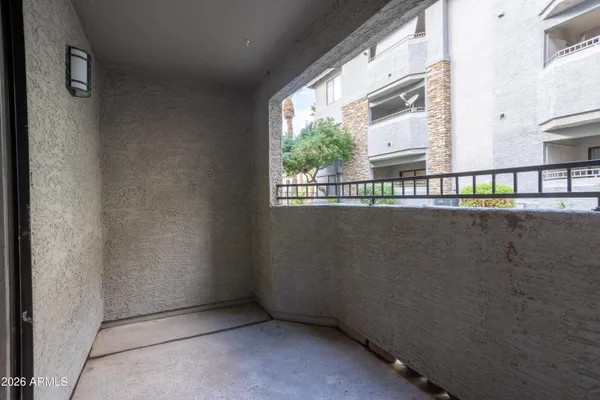 a view of a balcony with window