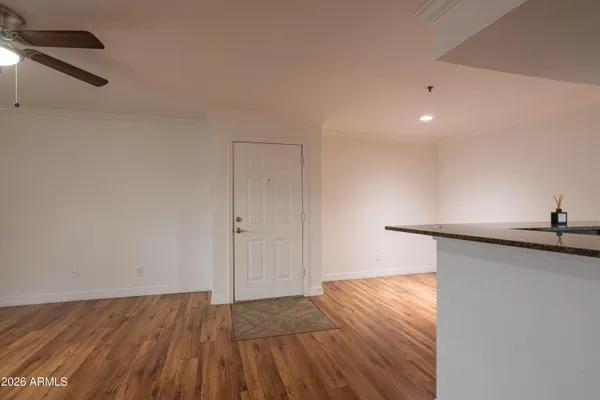 a view of a kitchen with wooden floor