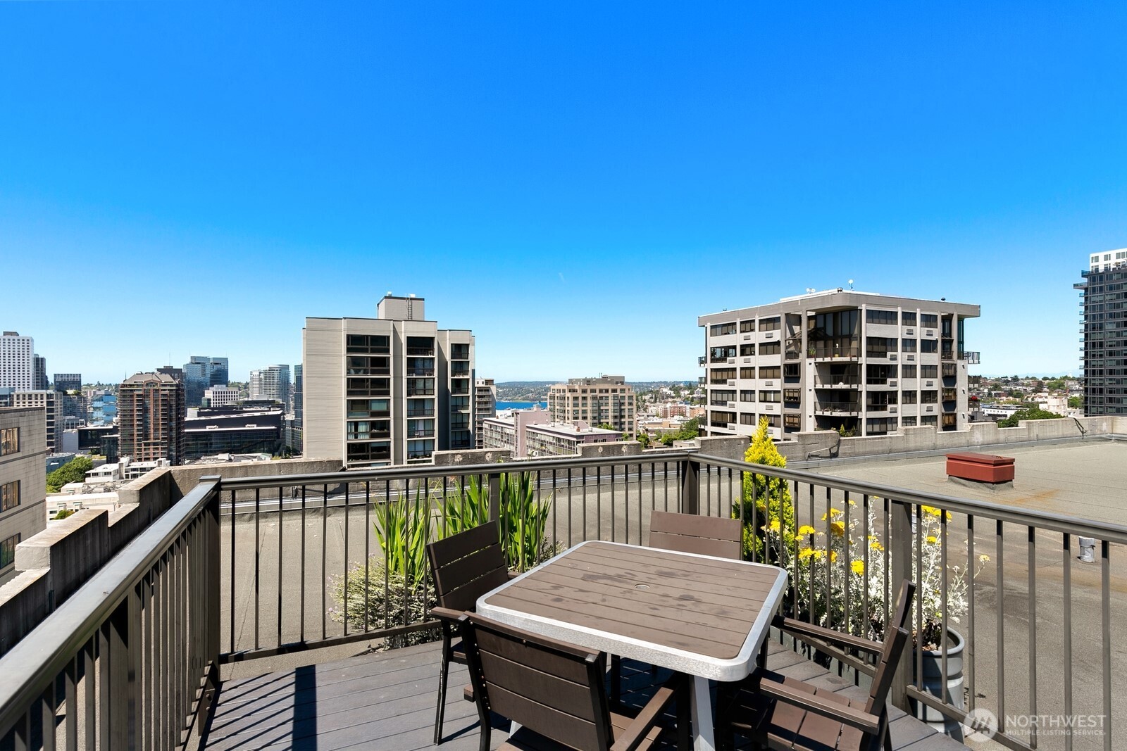 1105 Spring Street, Unit 1106 Seattle, WA 98104 - Photo 11 of 11 a view of a balcony with a chairs