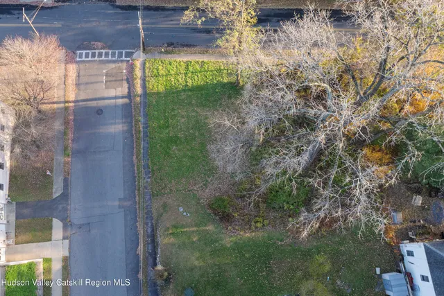 a view of a glass door with a yard