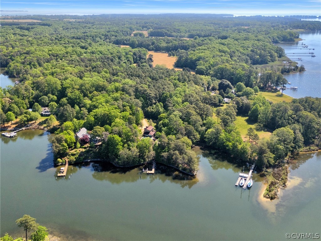 649 Kennsbury Road Hardyville, VA 23070 - Photo 1 of 50 an aerial view of a house with a lake view