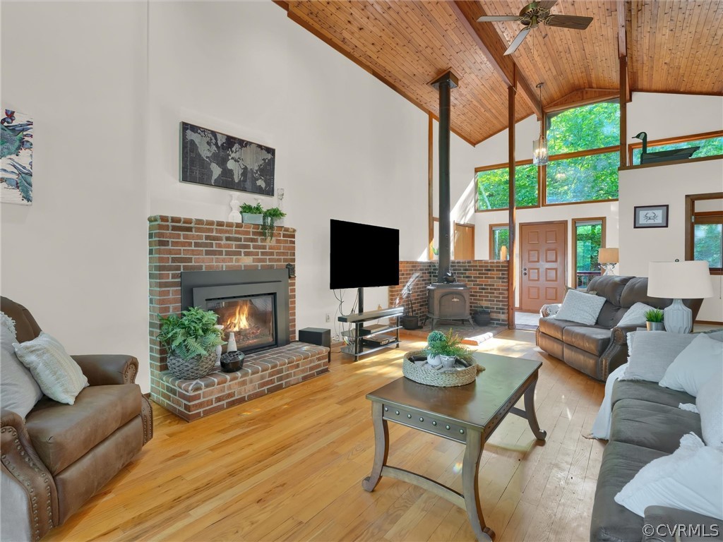 649 Kennsbury Road Hardyville, VA 23070 - Photo 11 of 50 a living room with furniture a flat screen tv and a fireplace