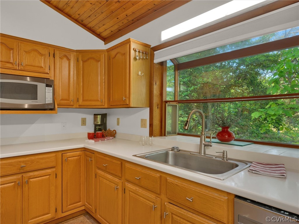 649 Kennsbury Road Hardyville, VA 23070 - Photo 17 of 50 a kitchen with stainless steel appliances a sink a microwave and cabinets