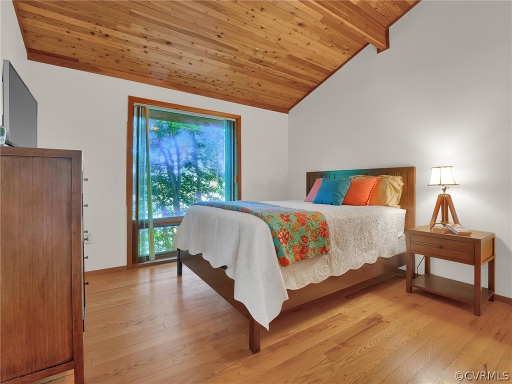 649 Kennsbury Road Hardyville, VA 23070 - Photo 19 of 50 a bedroom with a bed and wooden floor
