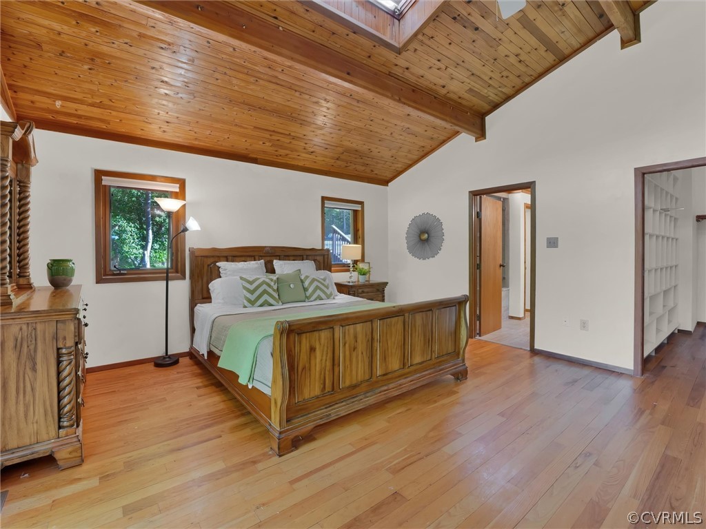 649 Kennsbury Road Hardyville, VA 23070 - Photo 20 of 50 a bedroom with a bed next to a window with wooden floor