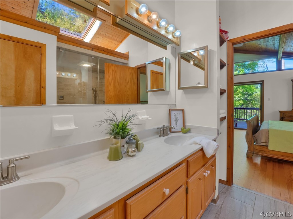 649 Kennsbury Road Hardyville, VA 23070 - Photo 22 of 50 a bathroom with a sink and a mirror