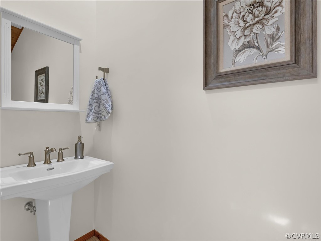 649 Kennsbury Road Hardyville, VA 23070 - Photo 25 of 50 a bathroom with a sink and a mirror