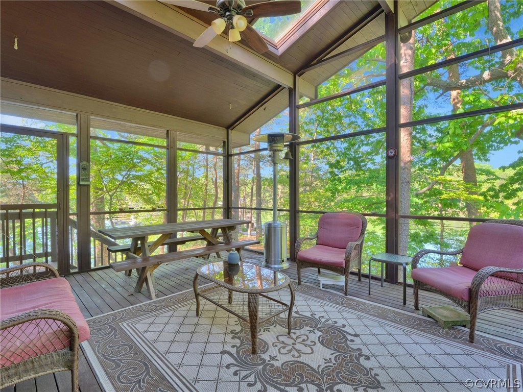 649 Kennsbury Road Hardyville, VA 23070 - Photo 31 of 50 a living room with furniture and floor to ceiling windows