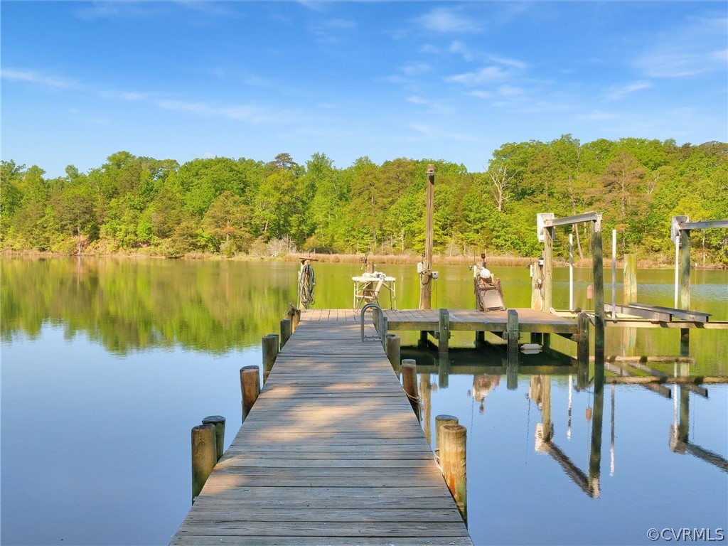 649 Kennsbury Road Hardyville, VA 23070 - Photo 35 of 50 a view of a lake with couches in front of it