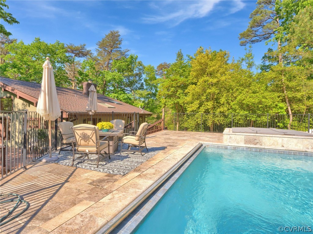 649 Kennsbury Road Hardyville, VA 23070 - Photo 36 of 50 a view of a swimming pool with a patio