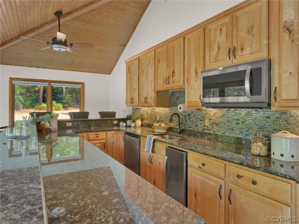 649 Kennsbury Road Hardyville, VA 23070 - Photo 40 of 50 a kitchen with stainless steel appliances granite countertop a stove sink and cabinets