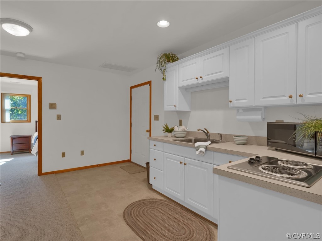 649 Kennsbury Road Hardyville, VA 23070 - Photo 43 of 50 a room with stainless steel appliances granite countertop a sink and cabinets