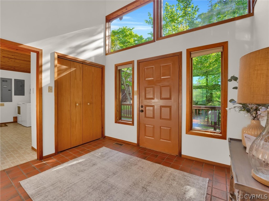 649 Kennsbury Road Hardyville, VA 23070 - Photo 8 of 50 an empty room with windows wooden floor and front door