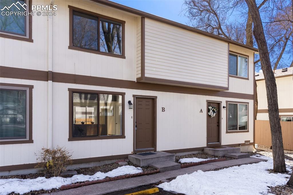 773 Alexander Road, Unit B Colorado Springs, CO 80909 - Photo 1 of 16 a front view of a house