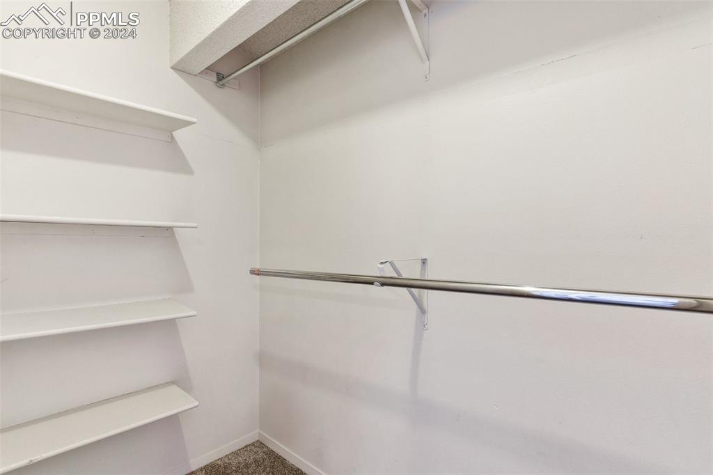 773 Alexander Road, Unit B Colorado Springs, CO 80909 - Photo 12 of 16 a view of a room with racks on the wall