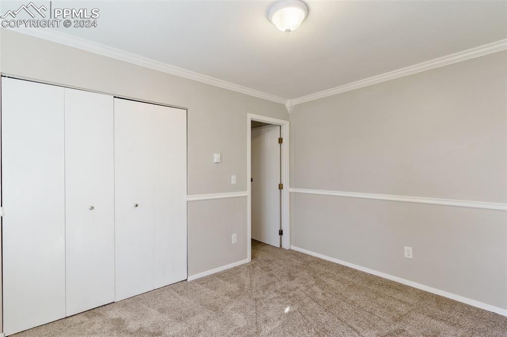 773 Alexander Road, Unit B Colorado Springs, CO 80909 - Photo 15 of 16 an empty room with an entryway