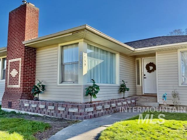 1139 Webster Street Clarkston, WA 99403 - Photo 1 of 34 Entrance to property featuring a chimney and a yard