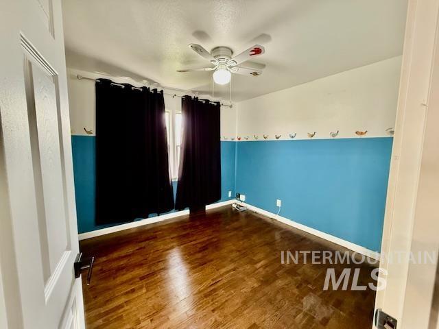 1139 Webster Street Clarkston, WA 99403 - Photo 17 of 34 Unfurnished room with dark wood-style flooring and ceiling fan